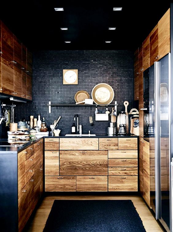 black-kitchen-with-natural-light-colored-wood-cabinetry